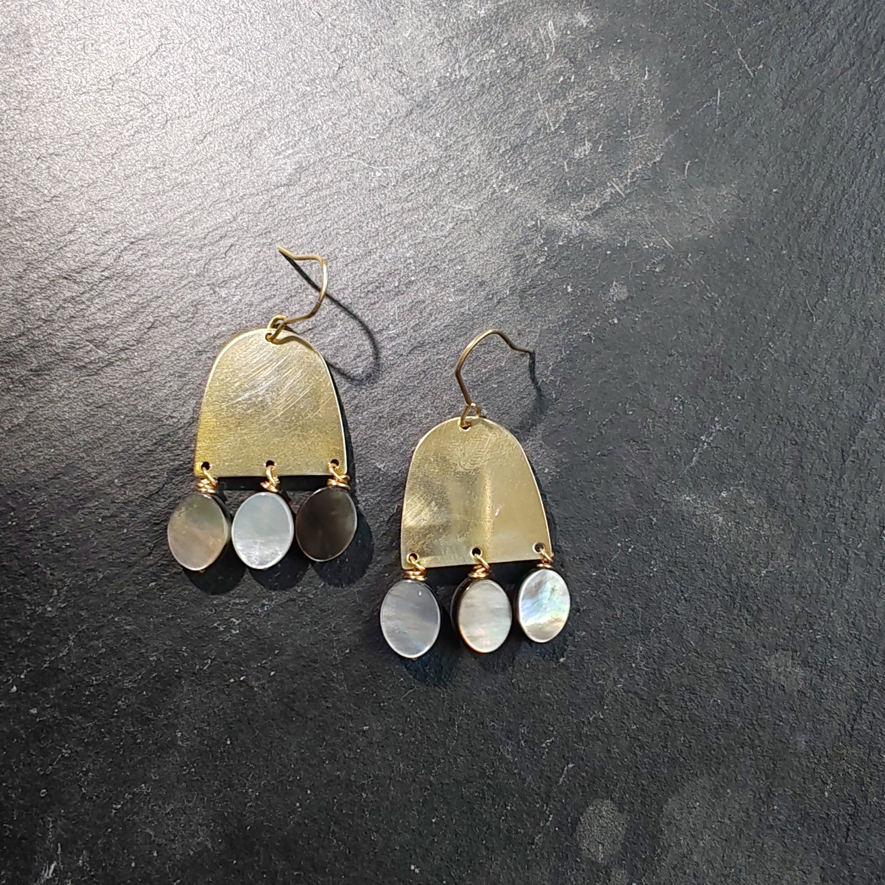 brass and grey shell earring