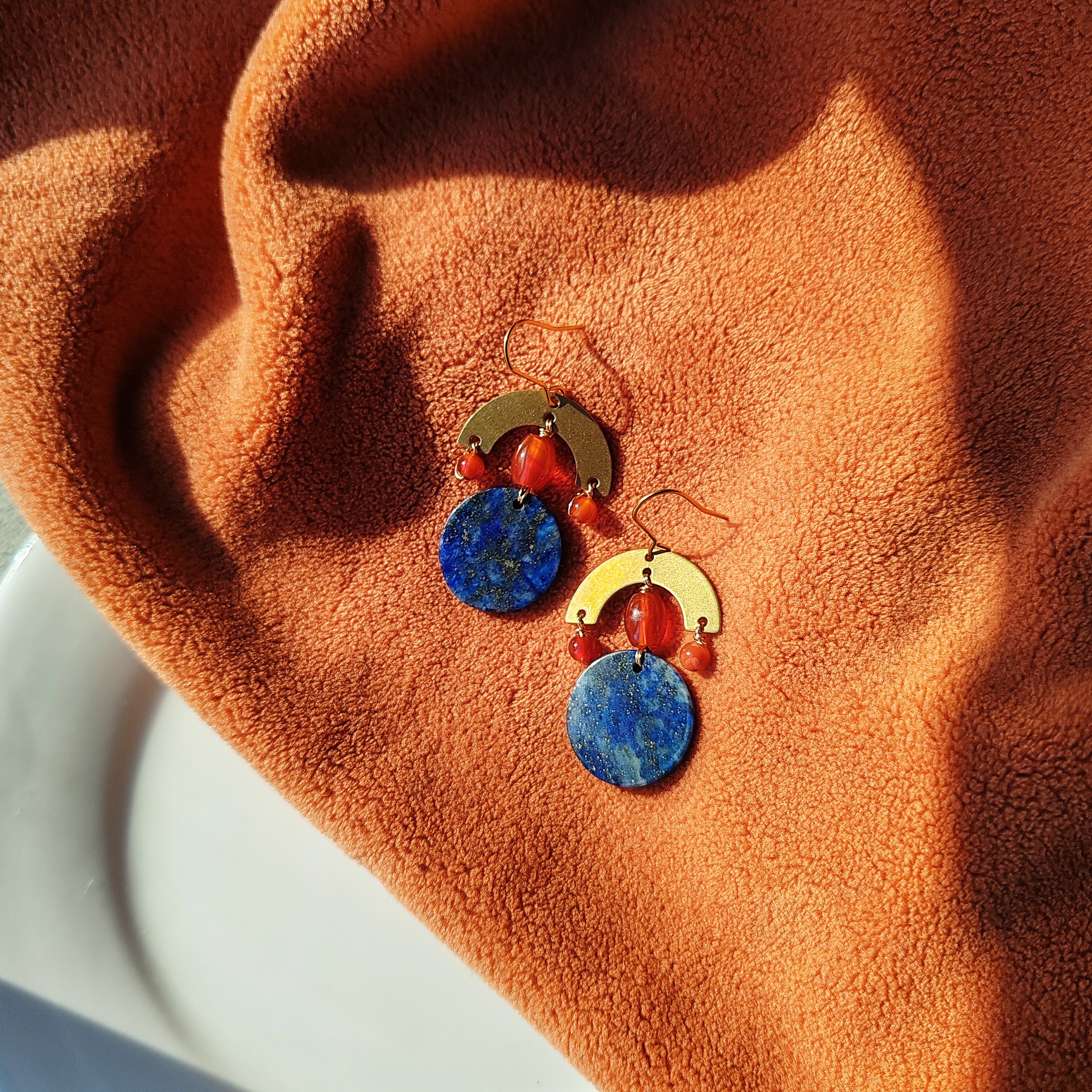 Brass and stone earrings, with lapis lazuli and red agate.