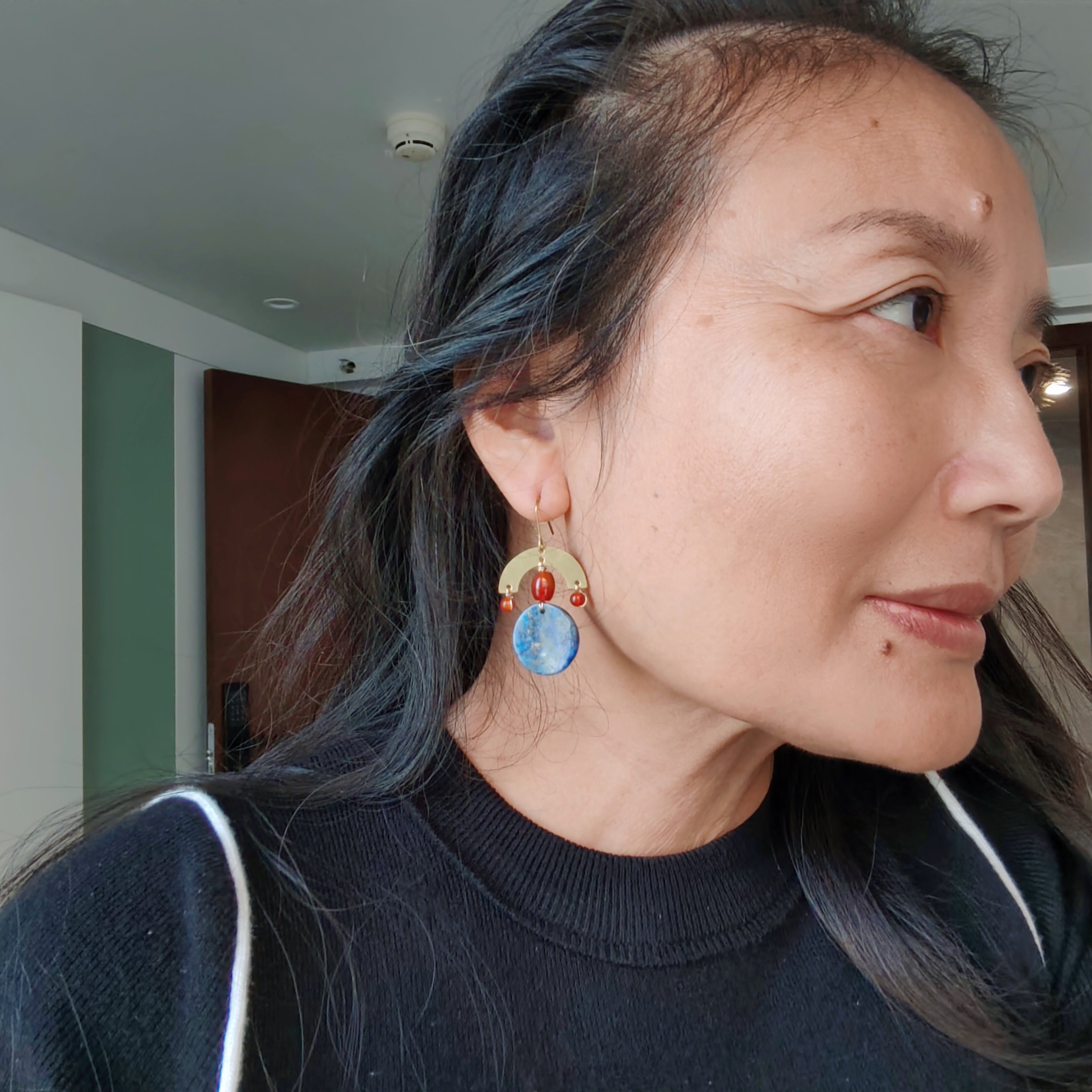 Brass and stone earrings, with lapis lazuli and red agate.