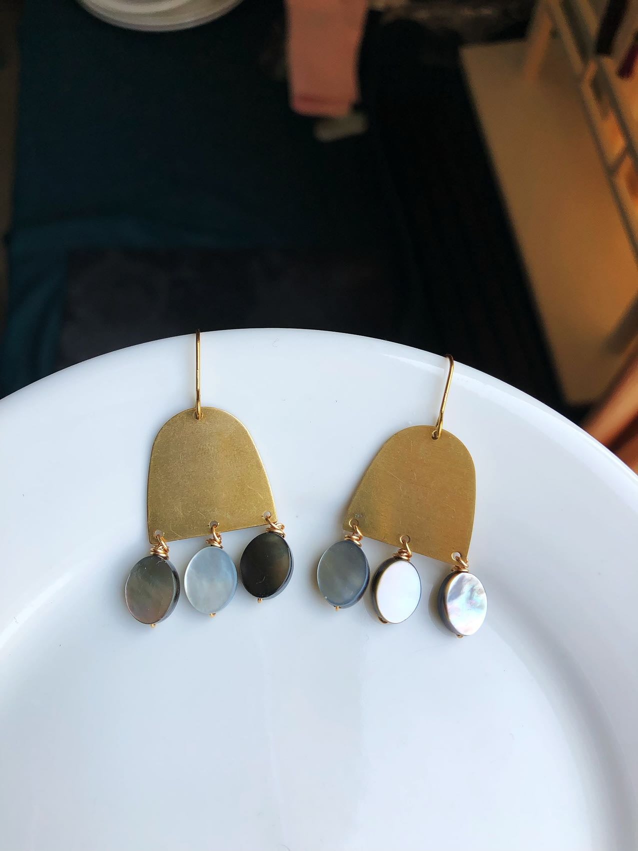 brass and grey shell earring